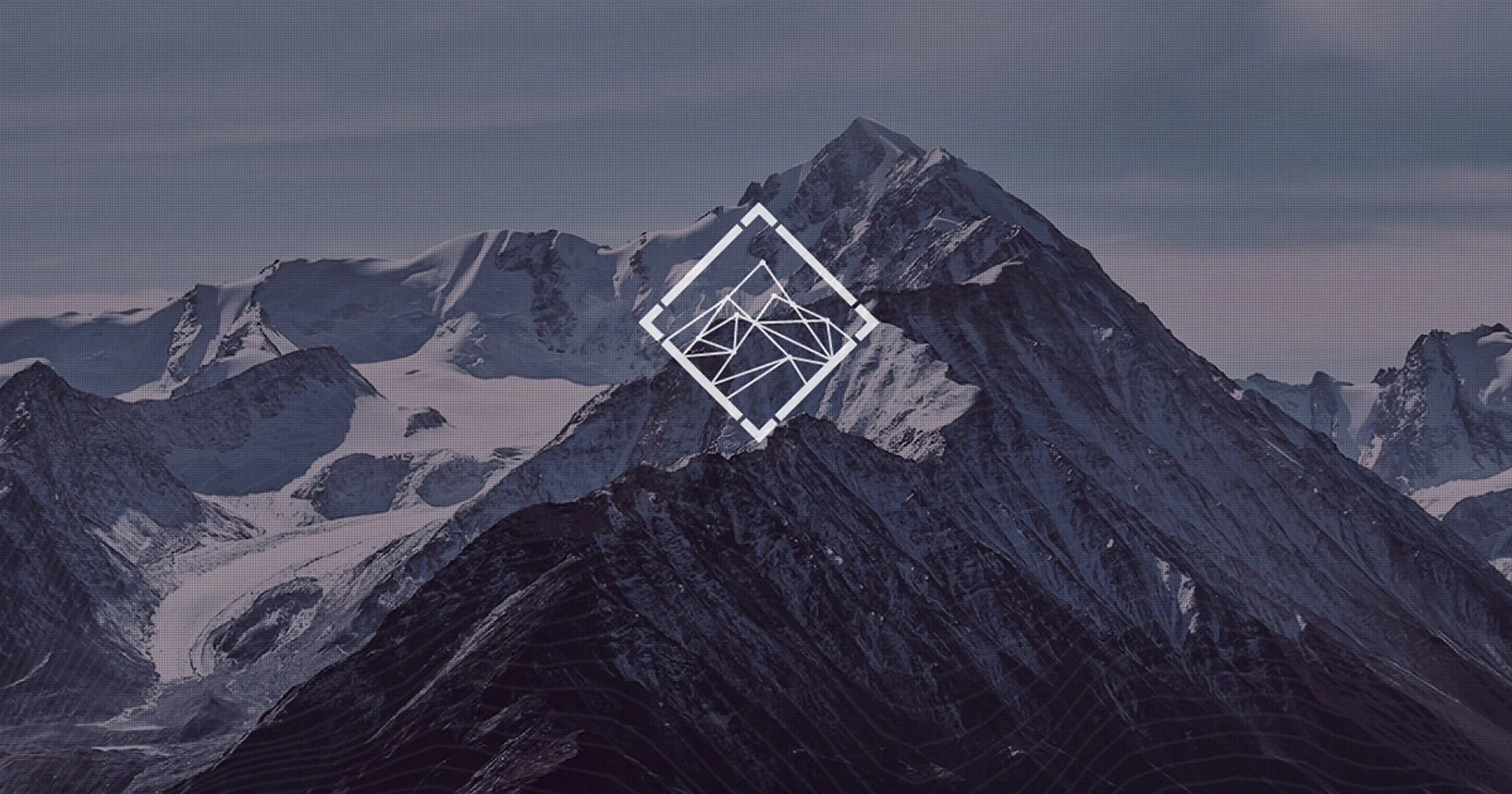 Snow-covered mountain ridge with a white diamond-shaped Carpathian Stake emblem